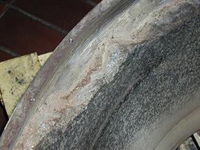 Damaged lining of vessel part caused by impact through years of service