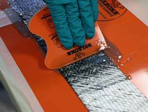 Wetting out the reinforcement sheet using the Belzona SuperWrap II fluid-grade resin